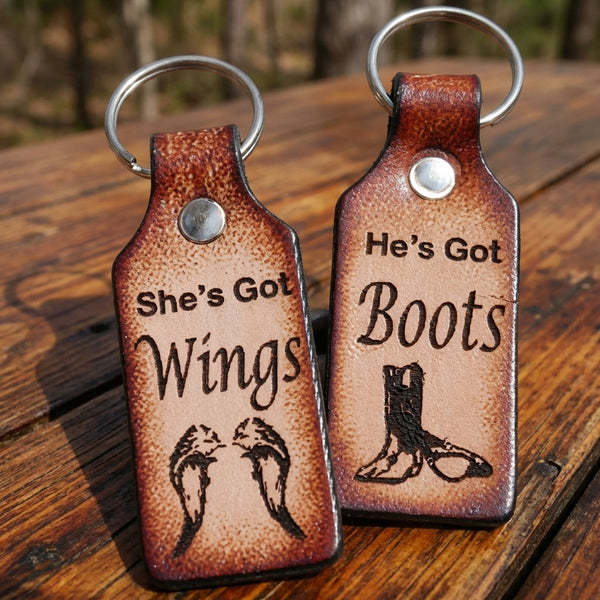 Handcrafted Leather Keychain Set for Couples - 'He's Got Boots, She's Got Wings'