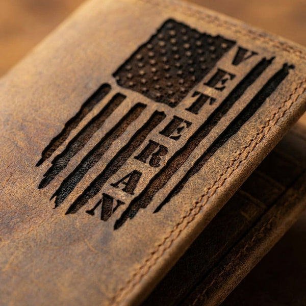 Distressed brown leather wallet featuring an embossed American flag design with VETERAN in the stripes.