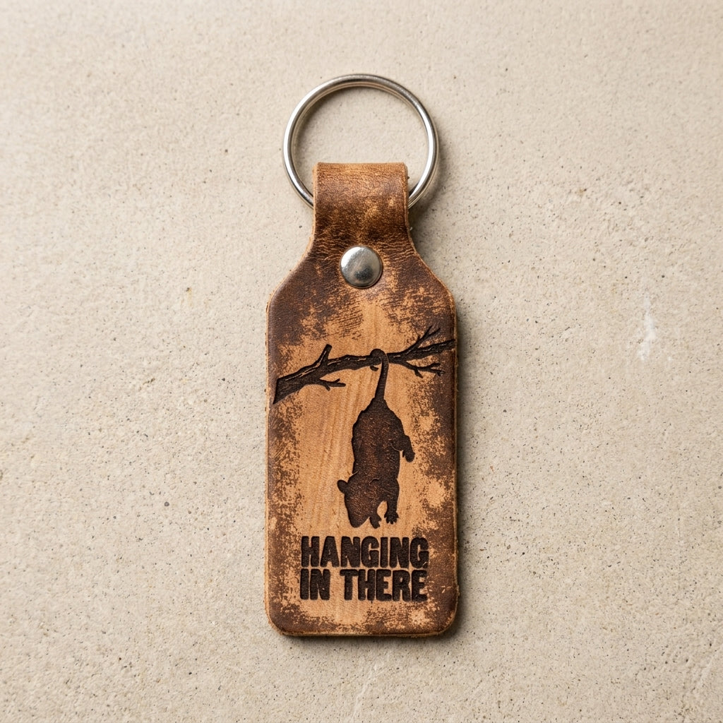 Hanging In There Opossum Engraved Leather Keychain