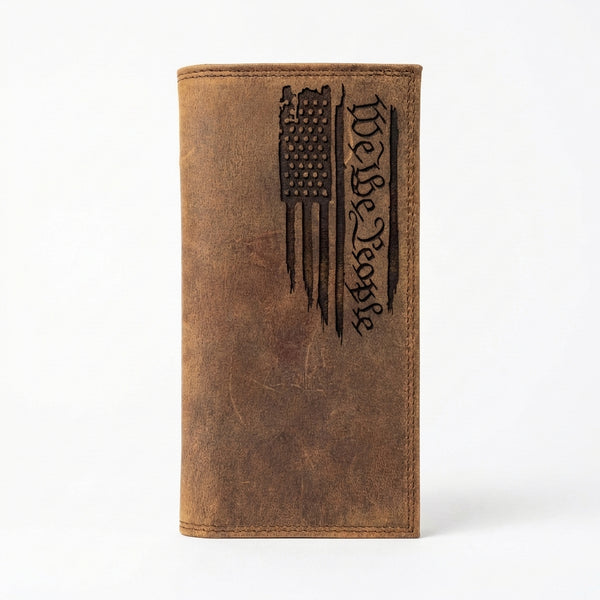 Brown leather long wallet with an engraved distressed American flag and "We the People" script.