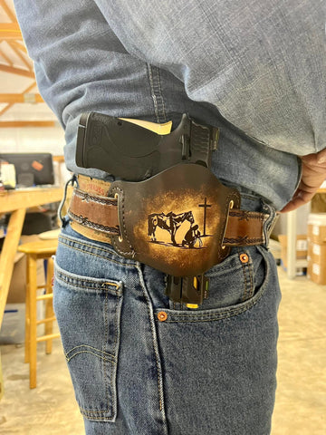 Cowboy Kneeling at the Cross Holster, Made in America by Miller's Leather Shop